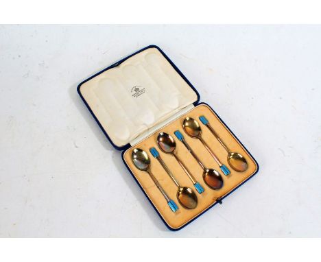 Set of Six George VI Art Deco silver coffee spoons, Birmingham 1937, maker Mappin &amp; Webb, the canted handles with engine 