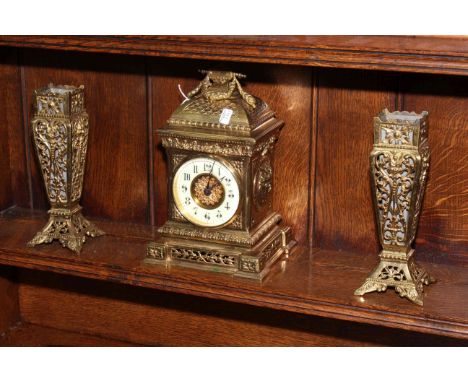 Ornate gilt metal three piece garniture clock set, clock 27cm high.