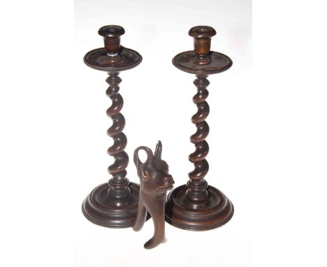 Black Forest carved Stag wall shelf, 25cm across, pair barley twist candlesticks and wood Ibex nut crackers (3).