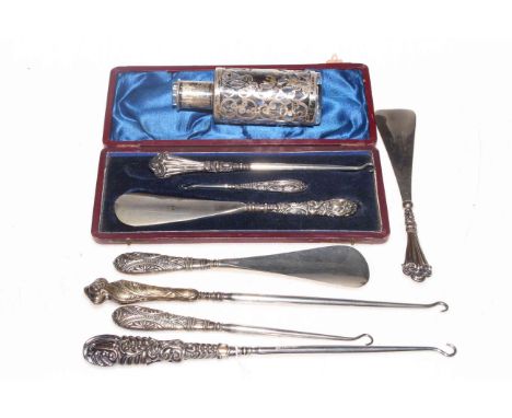 Silver scent bottle holder, Chester 1910, together with eight silver handled button hooks and shoe horns.