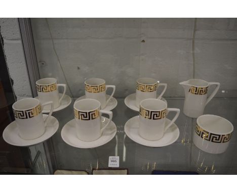 A set of six Portmeirion coffee cups and saucers, white ground with gilt Greek key border, together with the matching sugar b