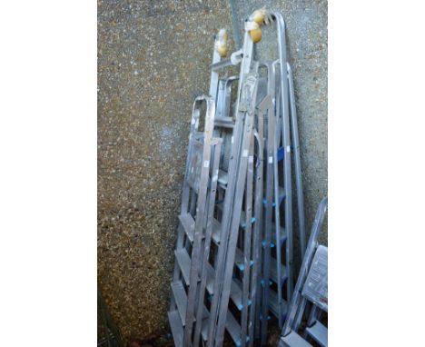Five various aluminium step ladders.