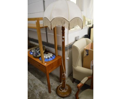 A mahogany standard lamp.