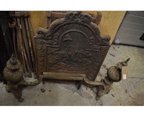 Old pair of cast iron fire dogs, cast iron fire back and a wrought iron grate.