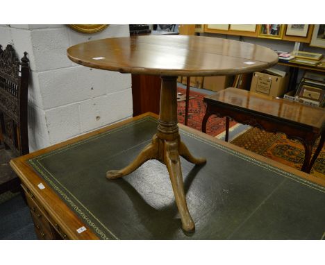 A 19th century tilt-top tripod table.