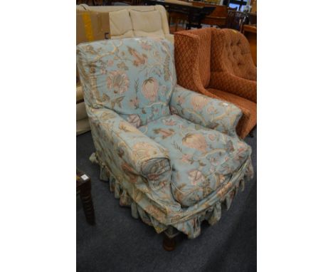 Hindley &amp; Wilkinson, an upholstered armchair on oak legs, castors stamped with makers name.