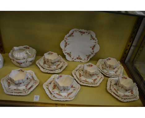 A floral decorated part tea service.