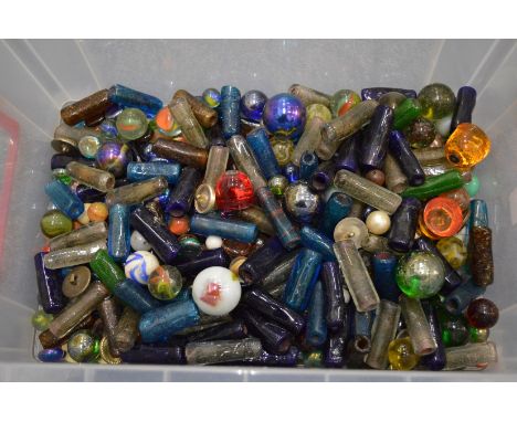 A quantity of marbles and other glassware.
