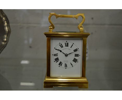 A large brass carriage clock, the dial signed Penlington &amp; Batty, Liverpool, the movement striking on a gong.