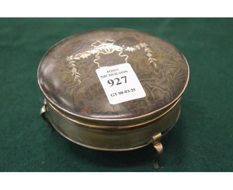 A silver and tortoiseshell trinket box.