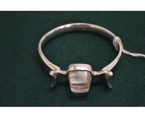 A Georg Jensen silver and rock crystal bangle.