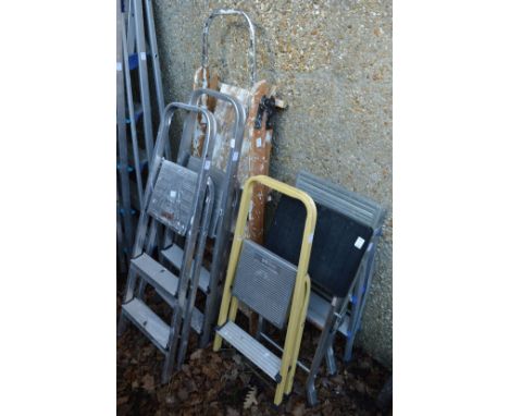 Six various step ladders.