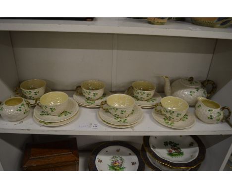 A Belleek six place tea service (lacking one tea plate).