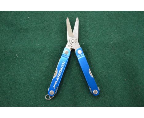 A Leatherman Micra folding multi tool.