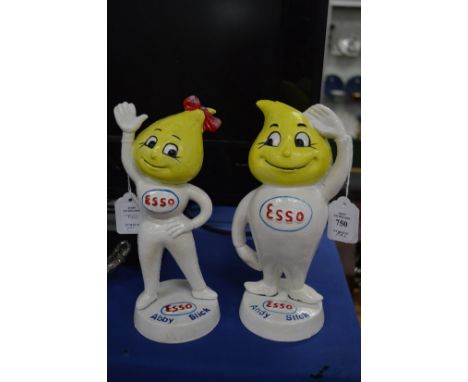 A pair of cast iron Esso figures.