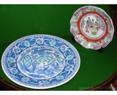 A 40cm diameter blue and white Turkish ceramic charger and a hand painted 27cm diameter shaped Chinese plate