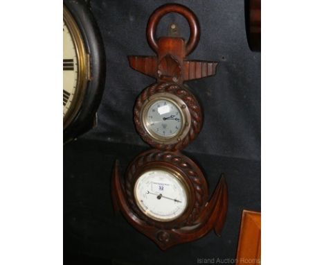Carved oak framed aneroid barometer/clock in the form of an anchor