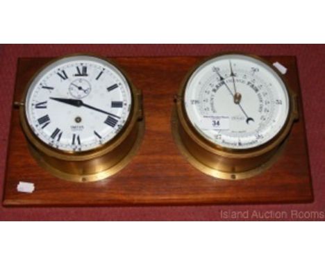 Brass cased ship's clock and barometer mounted on mahogany board