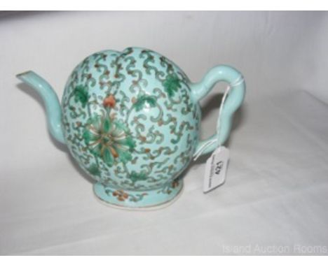 A 15cm peach shaped Chinese ceramic "Cadogan" teapot with lotus decoration