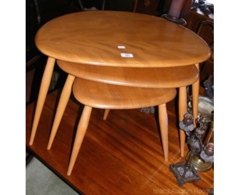 A nest of three Ercol "Golden Dawn" occasional tables