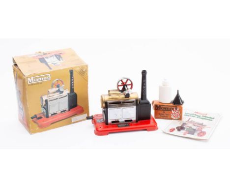 A boxed Mamod Steam Engine SP2:  black and brass on a  red base, with instructions and accessories. 