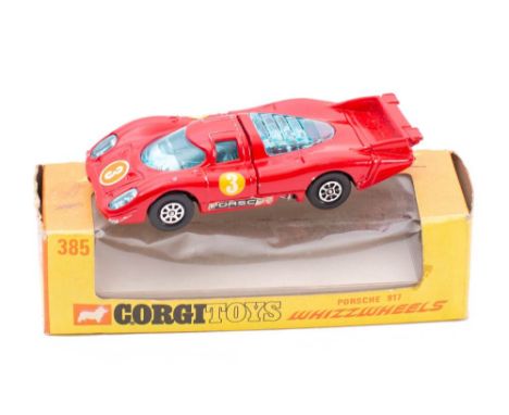 Corgi No 385 Porsche 917: red , blue tinted windows and lights, black base with Whizzwheels in an orange and yellow window bo