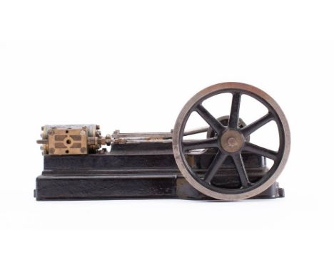Stuart Turner or similar. A live steam horizontal single piston engine: with seven spoked 3 3/4 inch flywheel and polished st