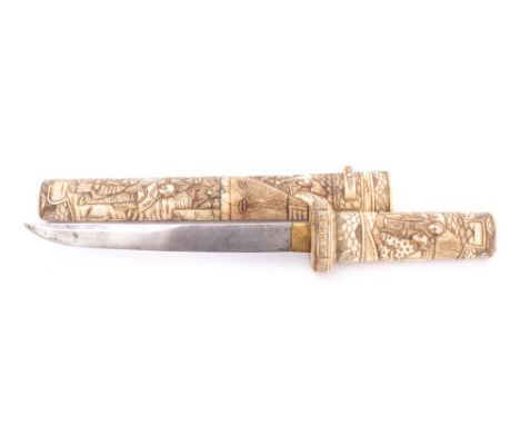 A 19th century tanto in carved bone scabbard: the short single edge blade with brass habaki over carved handle, in a two piec