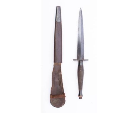 A WWII Second pattern Fairbairn Sykes Fighting knife: the straight double edge blade over  2 inch hit with chequered grip, to