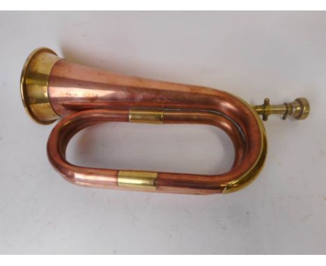 A Boosey &amp; Hawkes 400 copper and brass bugle: complete with mouthpiece. 