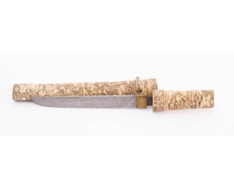 A 19th century tanto in carved bone scabbard: the short single edge blade with brass habaki over carved handle with Samurai d