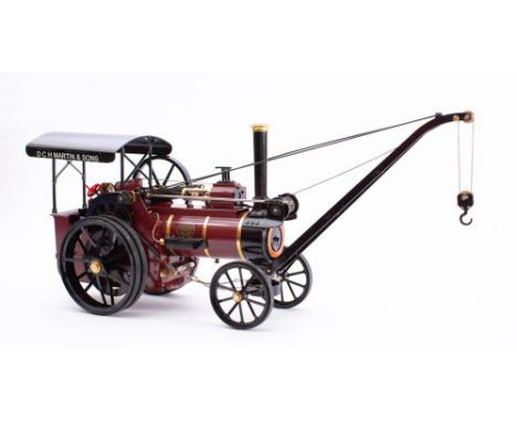 Maxitrak. A 3/4 inch scale Allchin live steam traction engine with crane: black roof, maroon body with brass fittings, in a w