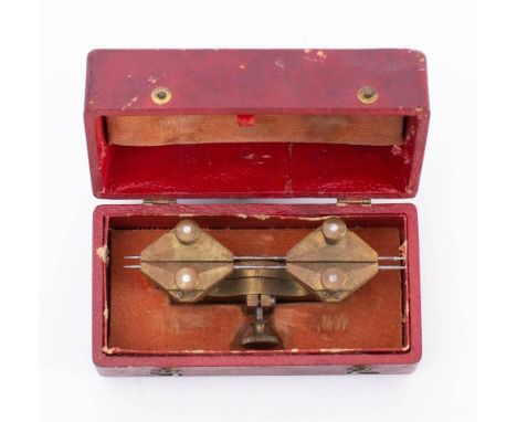 A vintage French watchmaker's brass depth tool: in red leather box inscribed 'Compass 26 Lignes'. 