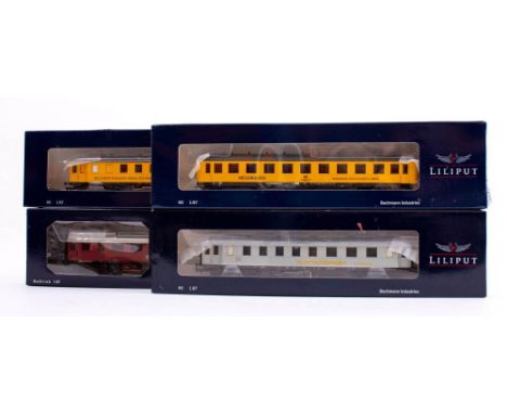 Liliput  (by Bachmann) HO. A boxed group of four passenger coaches: comprising L328731 Unterrichtswagen der DB EpocheIV, L382