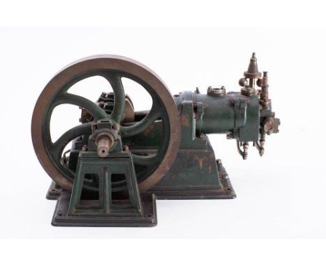 A live steam scale model of a single cylinder pump: unsigned, the 9 inch six spoke flywheel set beside a horizontal cylinder 