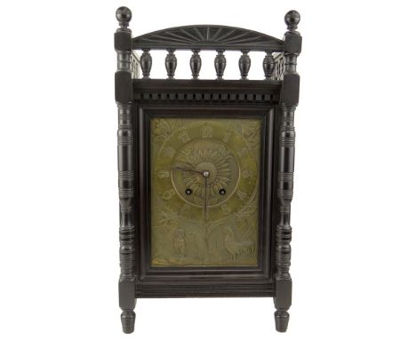Late 19th Century English Aesthetic Movement Carved and Ebonized Mantle Clock with Hammered Brass Face Possibly by Howell and