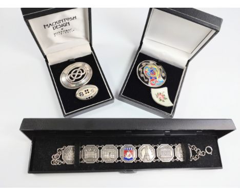 Four silver brooches and one bracelet in boxes, some with enamel decoration. 