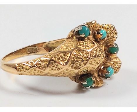 A hallmarked 18ct yellow gold turquoise ring, consisting of five turquoise stones, each set in a four-claw setting. Size K. 7