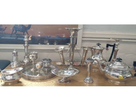 A quantity of electroplated Items. circa 1900. Including an epergne and a pair of candlesticks etc. (a lot) 
