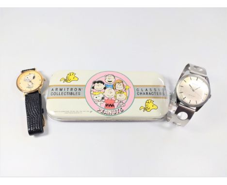 A Tissot watch 'Stylist' watch in stainless steel with racing sport bracelet, 1970 and a Peanuts watch with case