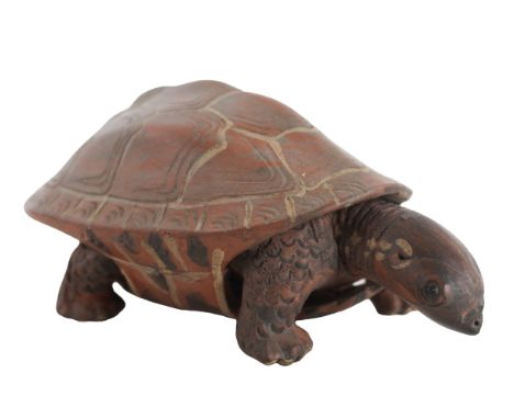 Asian Ceramic Turtle Contemporary. The underside marked. Decorated in tones of brown, with a moveable head and arms. Size: 5 