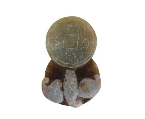 Chinese Jade Study of a Fish Atop Coins. The greenish gray jade of two overlapping coins surmounted by a fish. Size: 2 1/2 x 