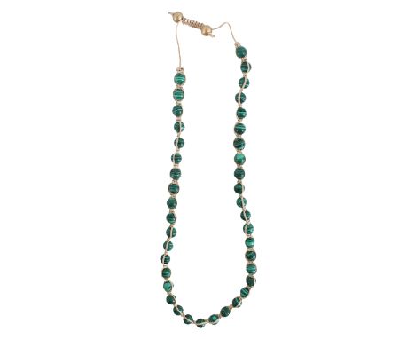 Each bead with light and dark green striations. Size: 9 7/8 in. length.