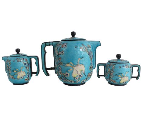 Late 19th/early 20th Century. Unmarked. The three-piece set, comprising a teapot, covered sugar and a creamer, of ovoid shape