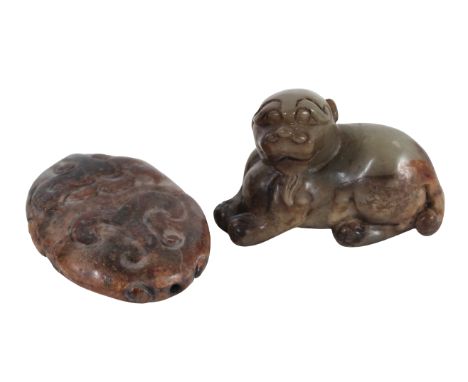 Two Chinese Jade and Stone Carvings. The first, a mottled gray and brown jade resting puppy, the second, an allover mottled p