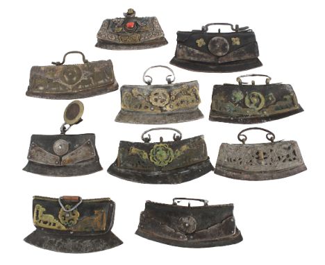 19th Century. Of typical form, each with a convex steel striking plate and chased metal mounts fitted to a leather pouch, som