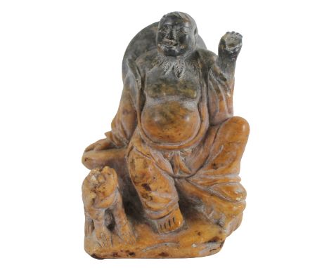 Chinese Carved Soapstone Figure 20th Century. The overweight gentleman seated upon a boulder, his dog by his side. Size: 3 1/