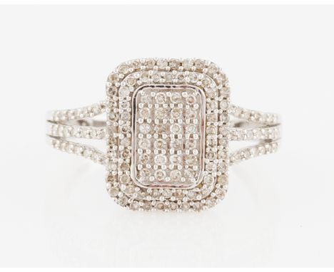 A 9ct white gold diamond cluster ring, the square head design set with eight-cut diamonds to diamond set split shoulders, hal