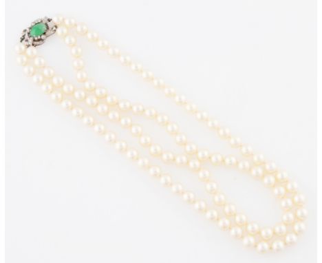 A double string of pearls, the strings totalling approx. 99 white pearls with an average diameter 7mm, with pink overtone, cl
