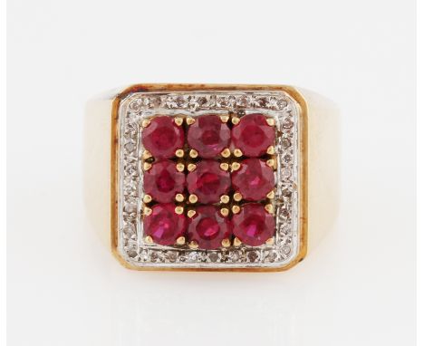 A ruby and diamond ring, set with nine round cut rubies (possibly synthetic), surrounded by a border of eight-cut diamond acc